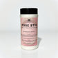 Container of Pixie Stix carpet and upholstery refresher on a white background