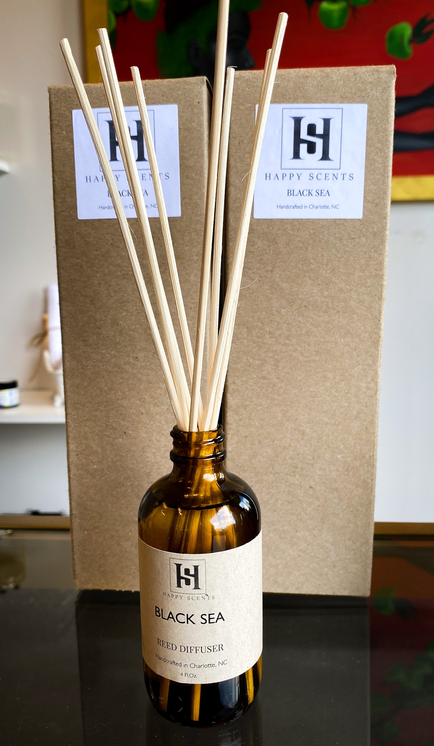 Black Sea Reed Diffuser by Happy Scents. Display of how to arrange reed diffuser for flame free fragrance throughout your space. 